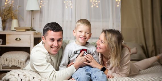 a family sitting on a couch
